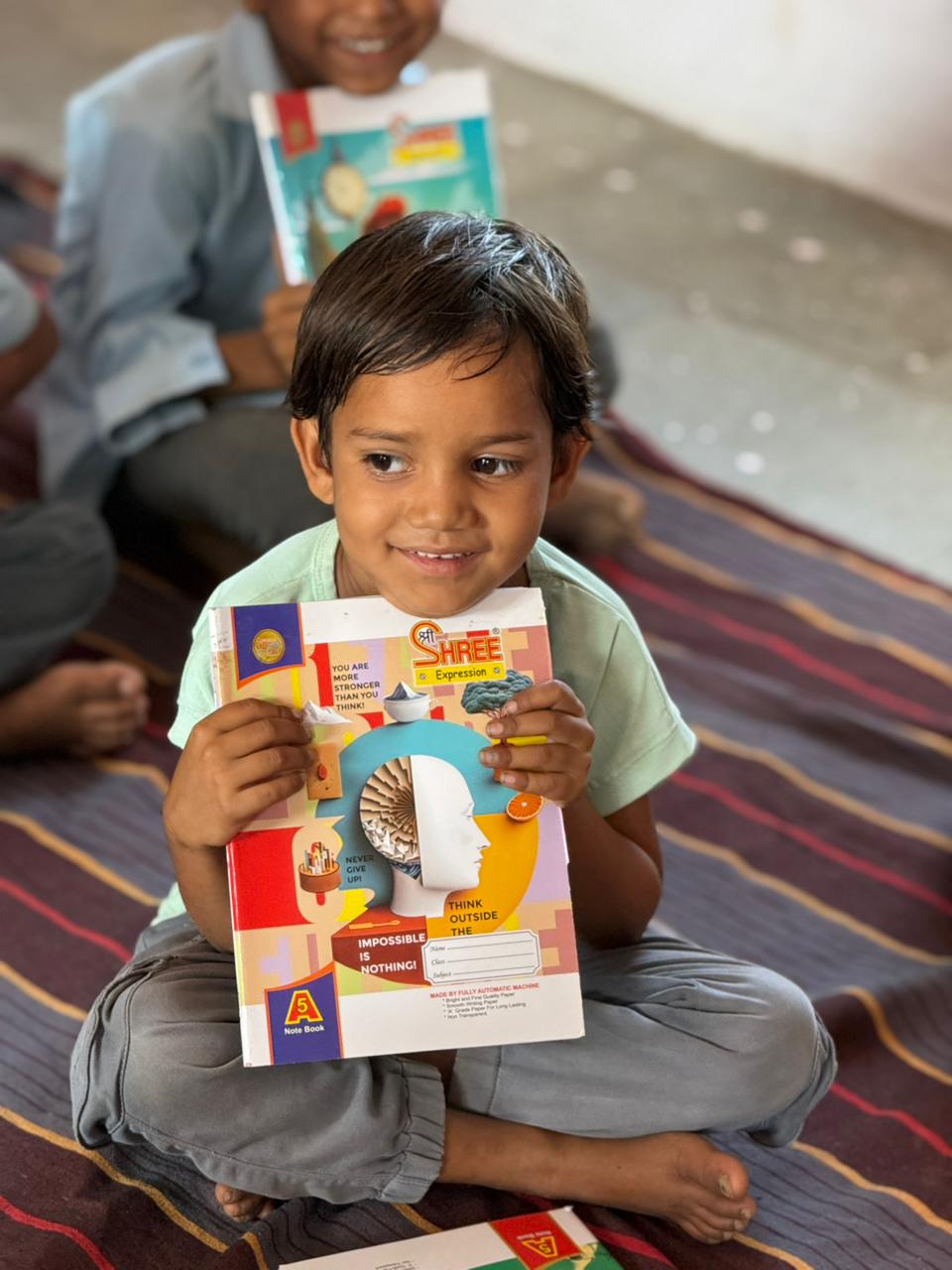 Children receive educational supplies at Nayakhola School